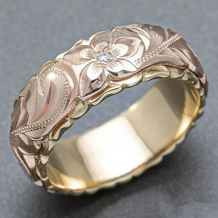 Goldener Ring mit rosa Blumenelementen